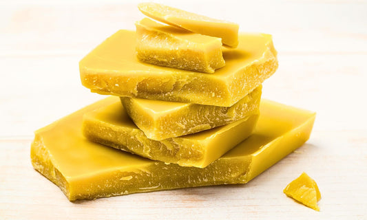 Beeswax stacked on a white background