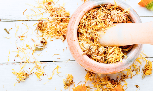Calendula Botanicals in a Mortar and Pestel. 