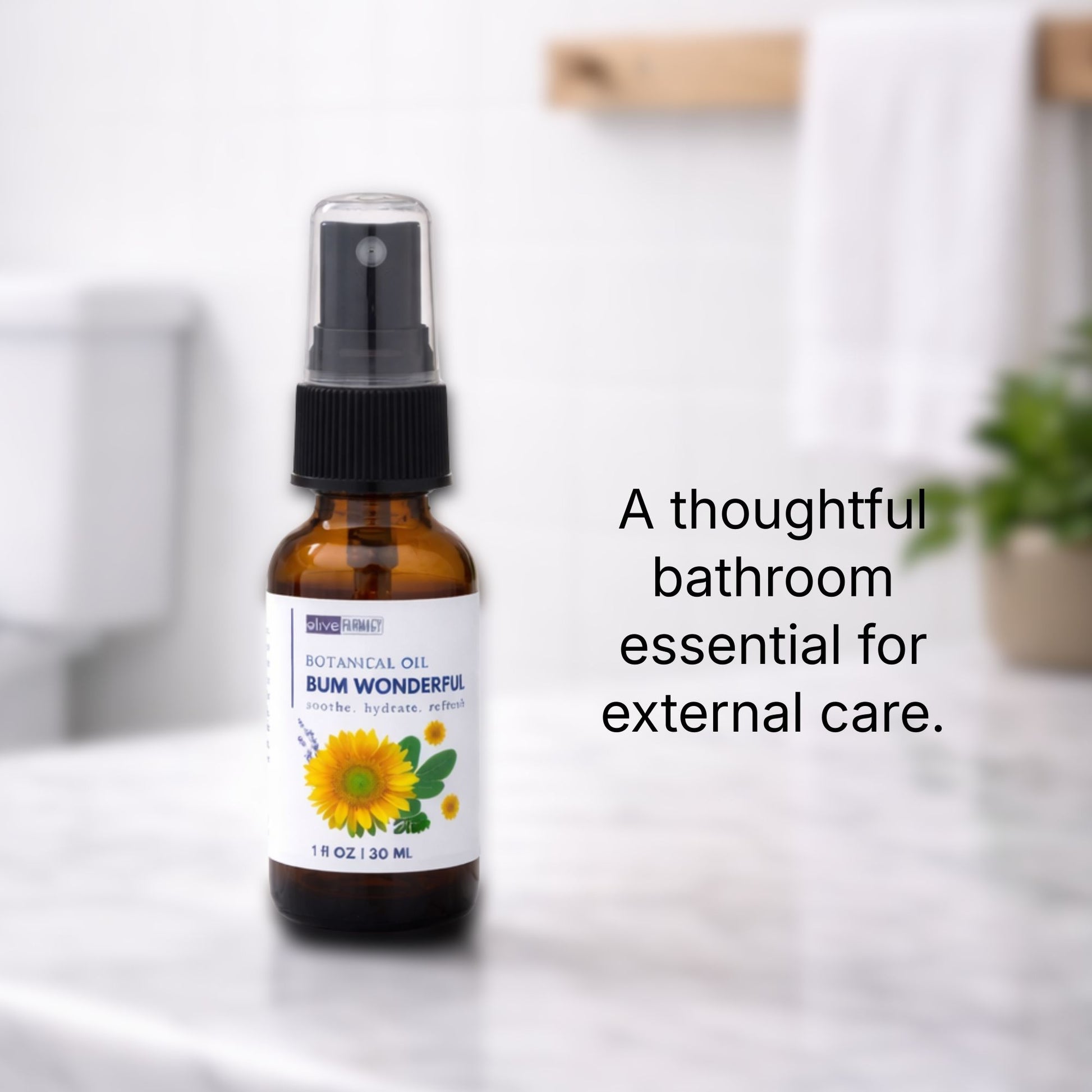 An amber glass sprayer bottle of Bum Wonderful on a white marble countertop. 